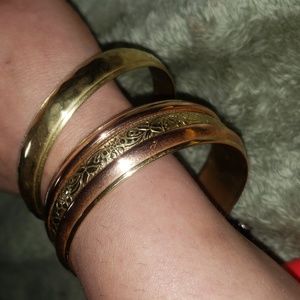 Two brass bangles one is brass and copper